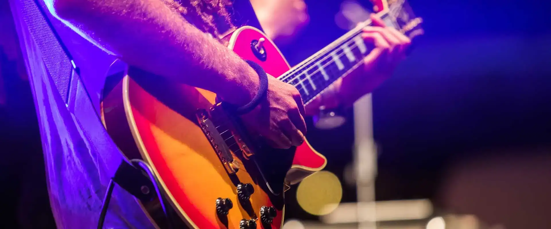 Guy playing a guitar.