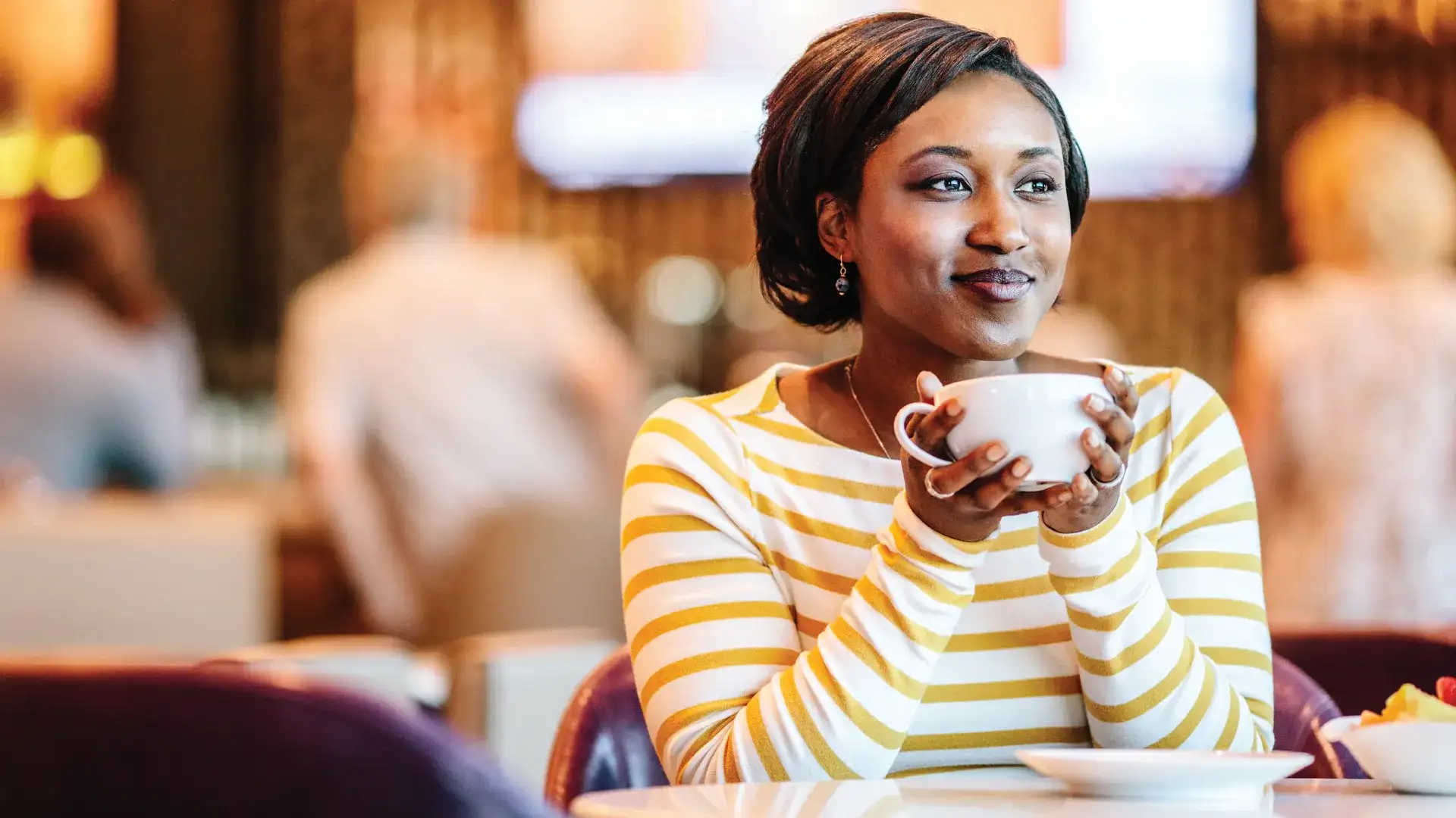 Woman enjoying a cup of coffee.