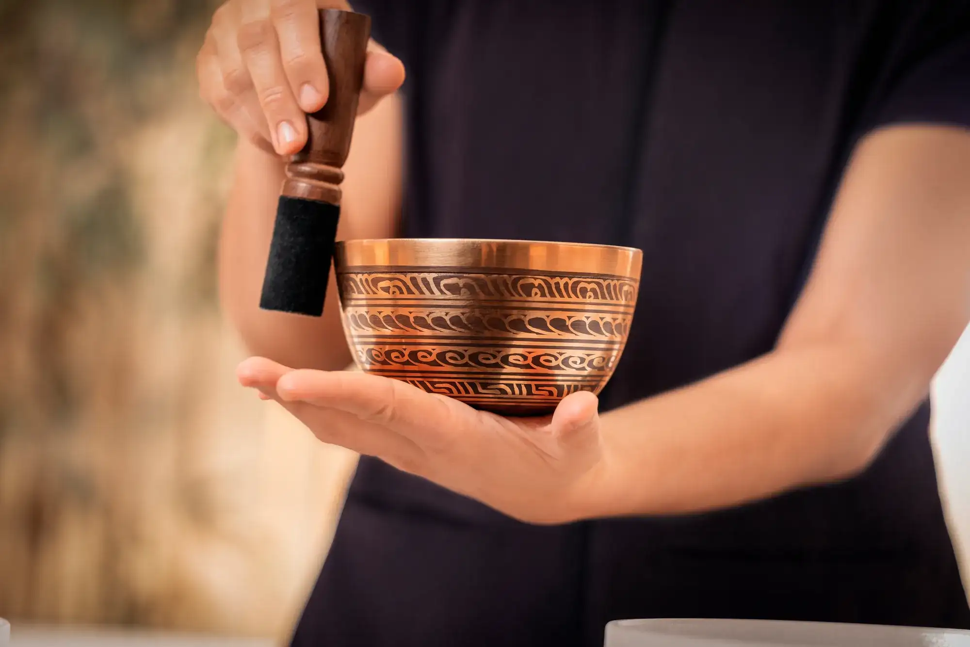 Tibetan singing bowl with etched copper design held in the Nobu Hotel lobby at Caesars Palace