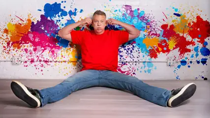 Gary Owen against painted wall