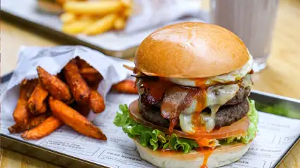 Double cheeseburger and sweet potato fries at Gordon Ramsay Street Burger.