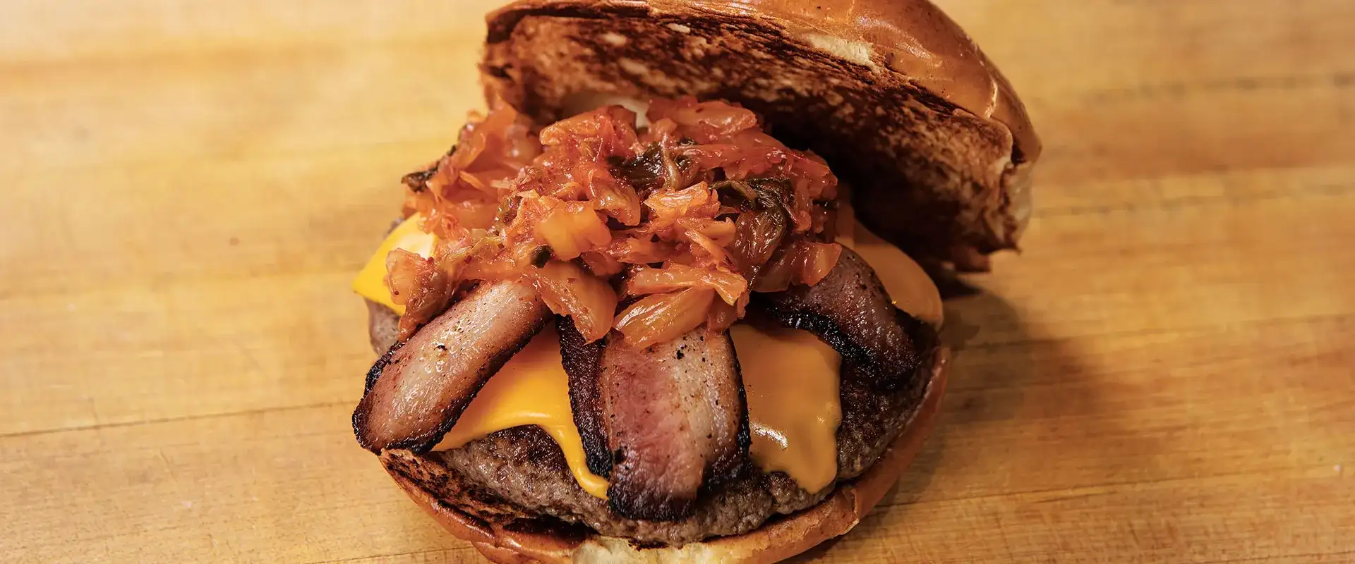 Bacon cheeseburger with onion topping