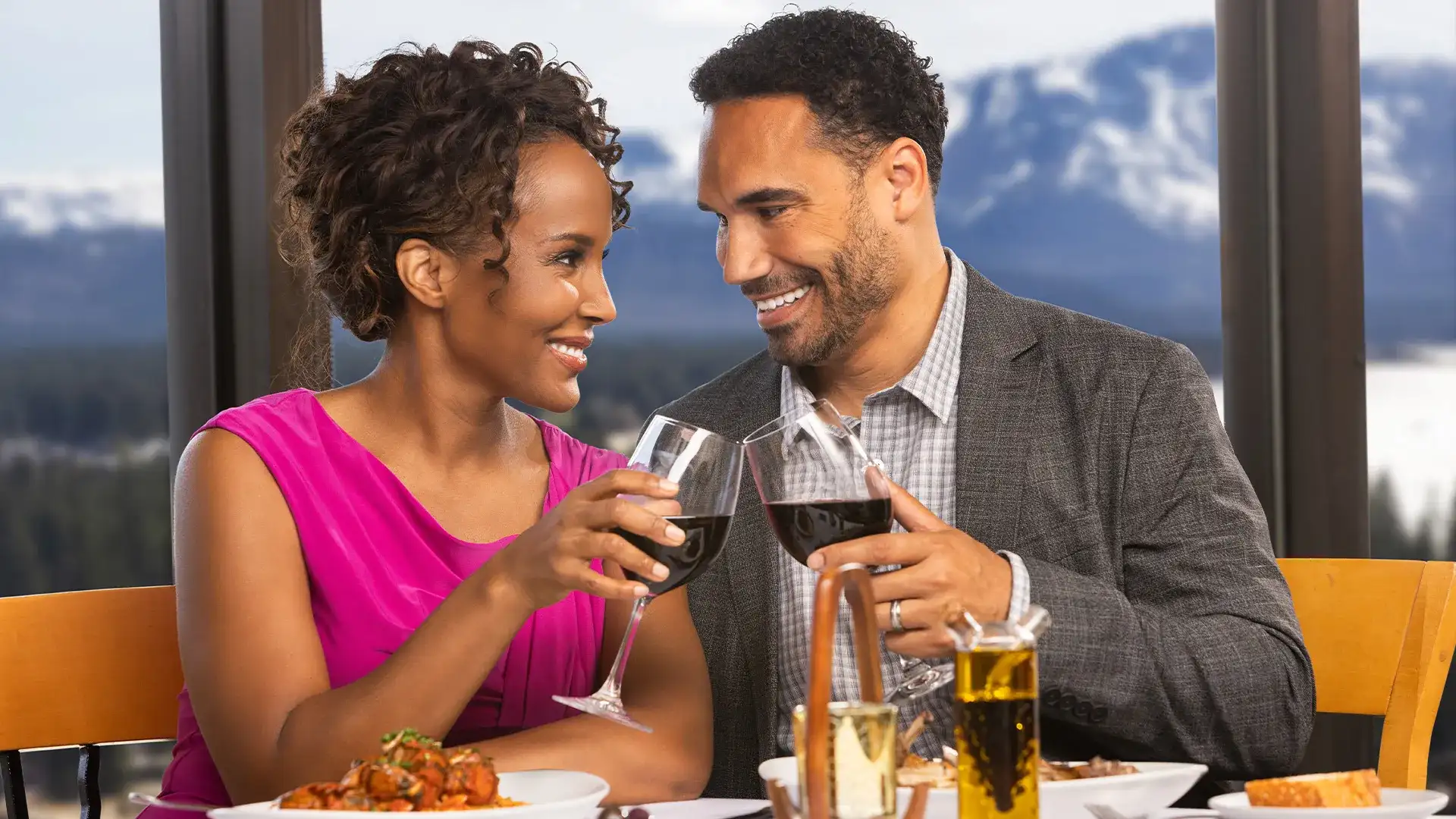 Couple toasting glasses.