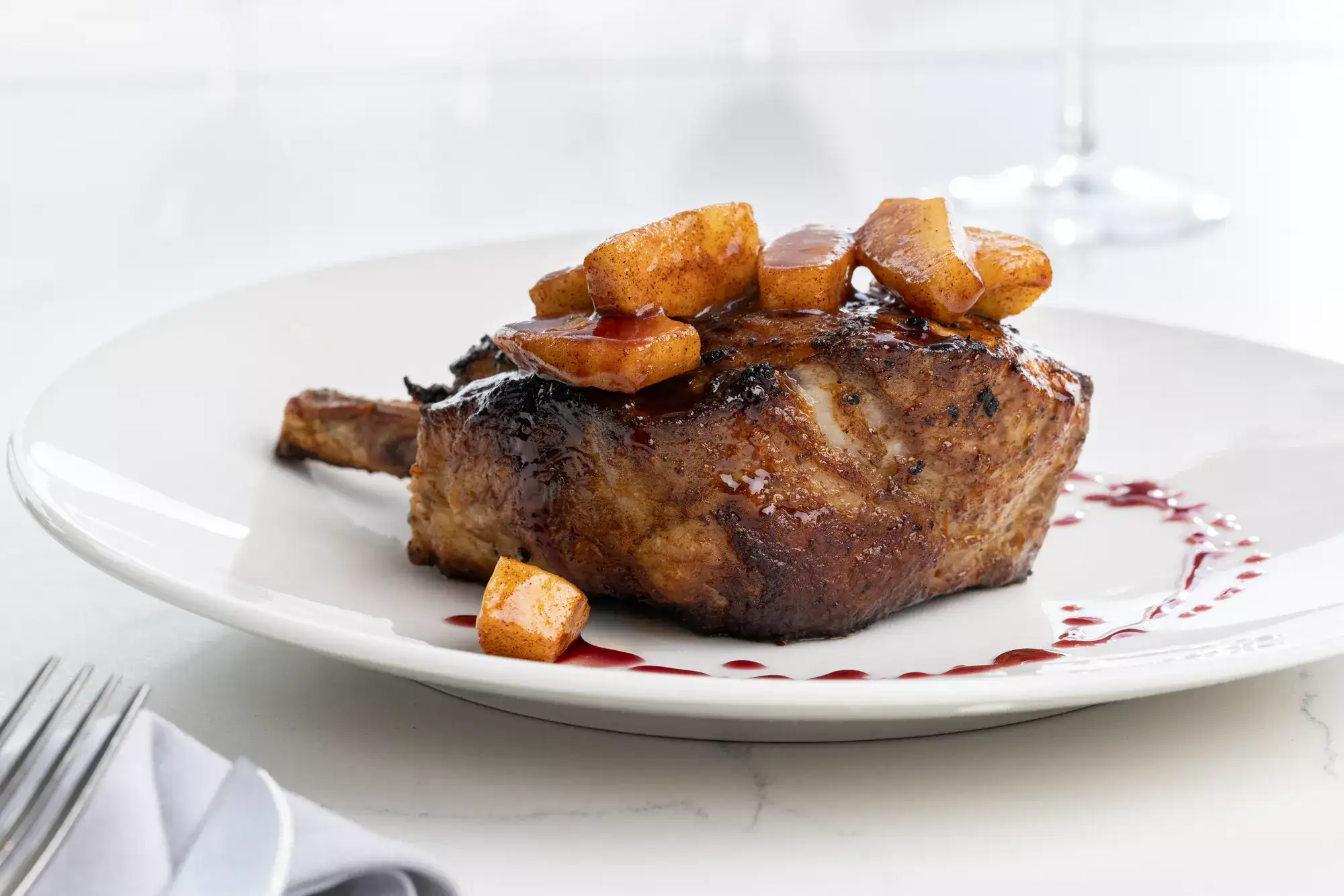 Plated porkchop from Chelsea Five restaurant
