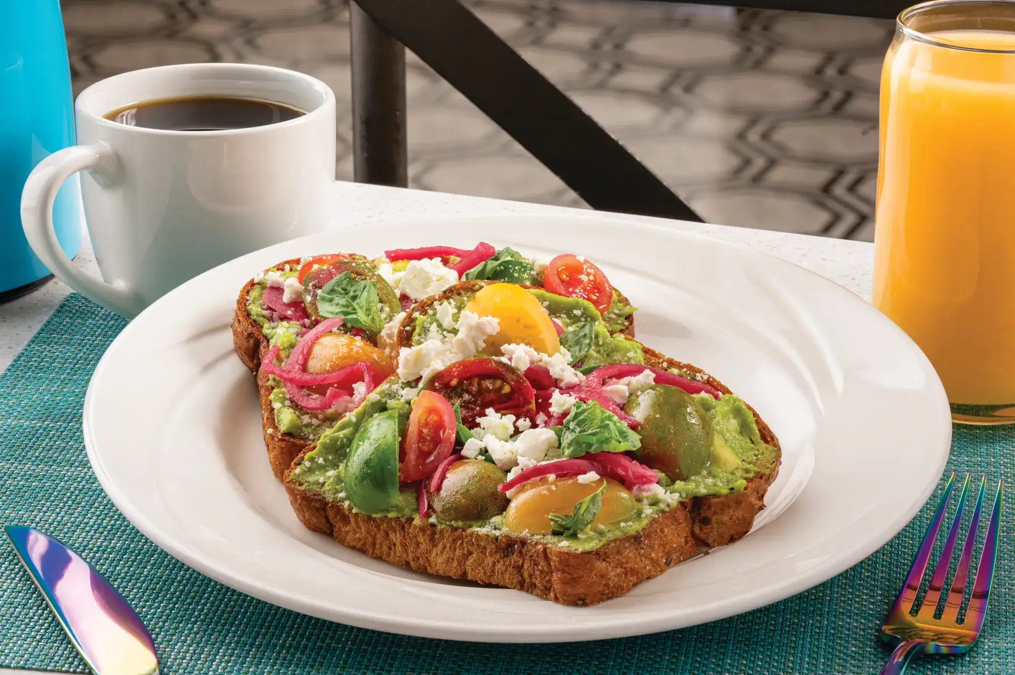 Avocado Toast - Whole grain bread, avocado spread, cherry tomatoes, pickled red onion