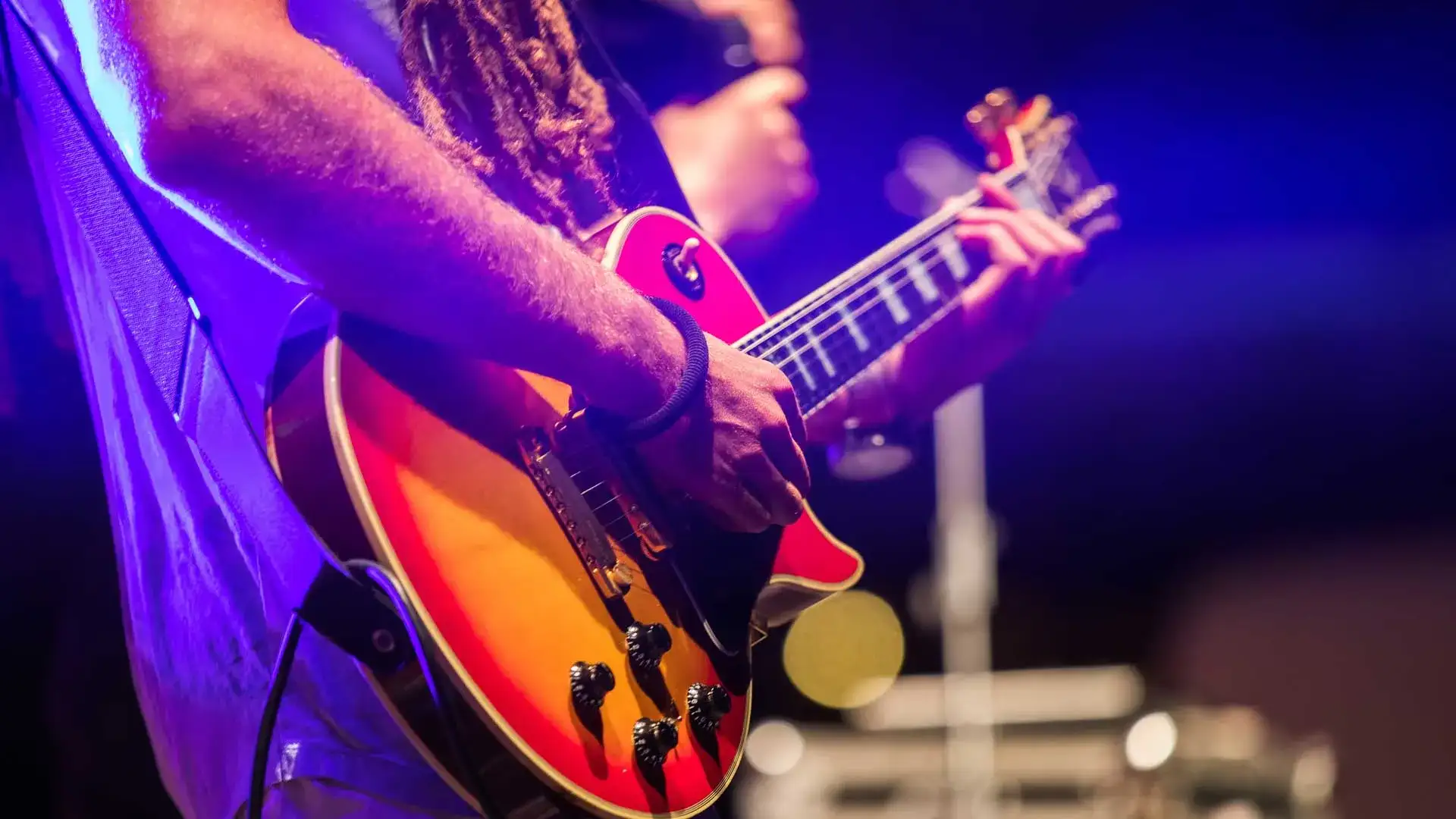 Man playing the guitar.