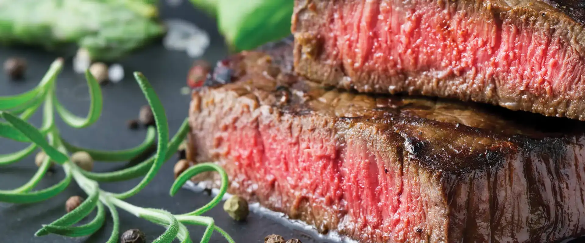 Sliced steak with pink middle.