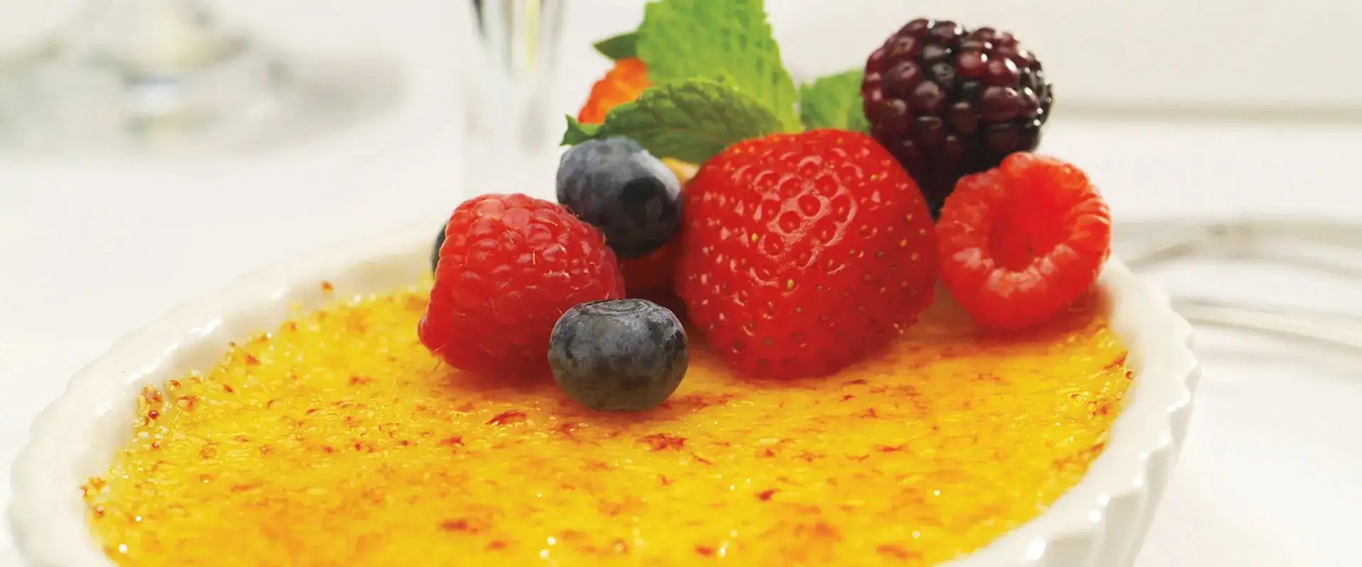 Creme brulee with fresh berries on top.