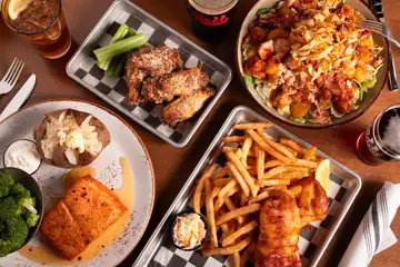 Looking down from above a tablescape of The Brew Brothers plates of food.