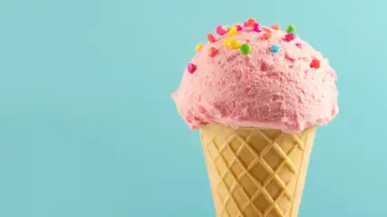 Ice cream cone with sprinkles.