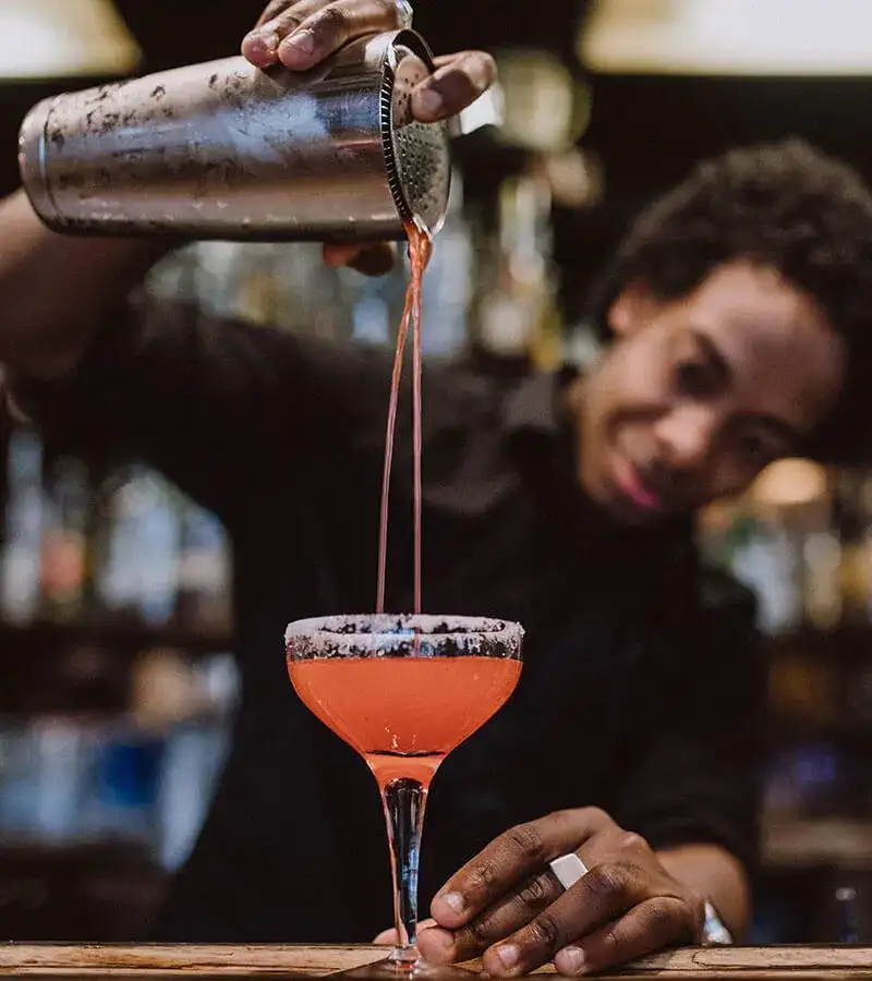 Bartender pouring a drink.