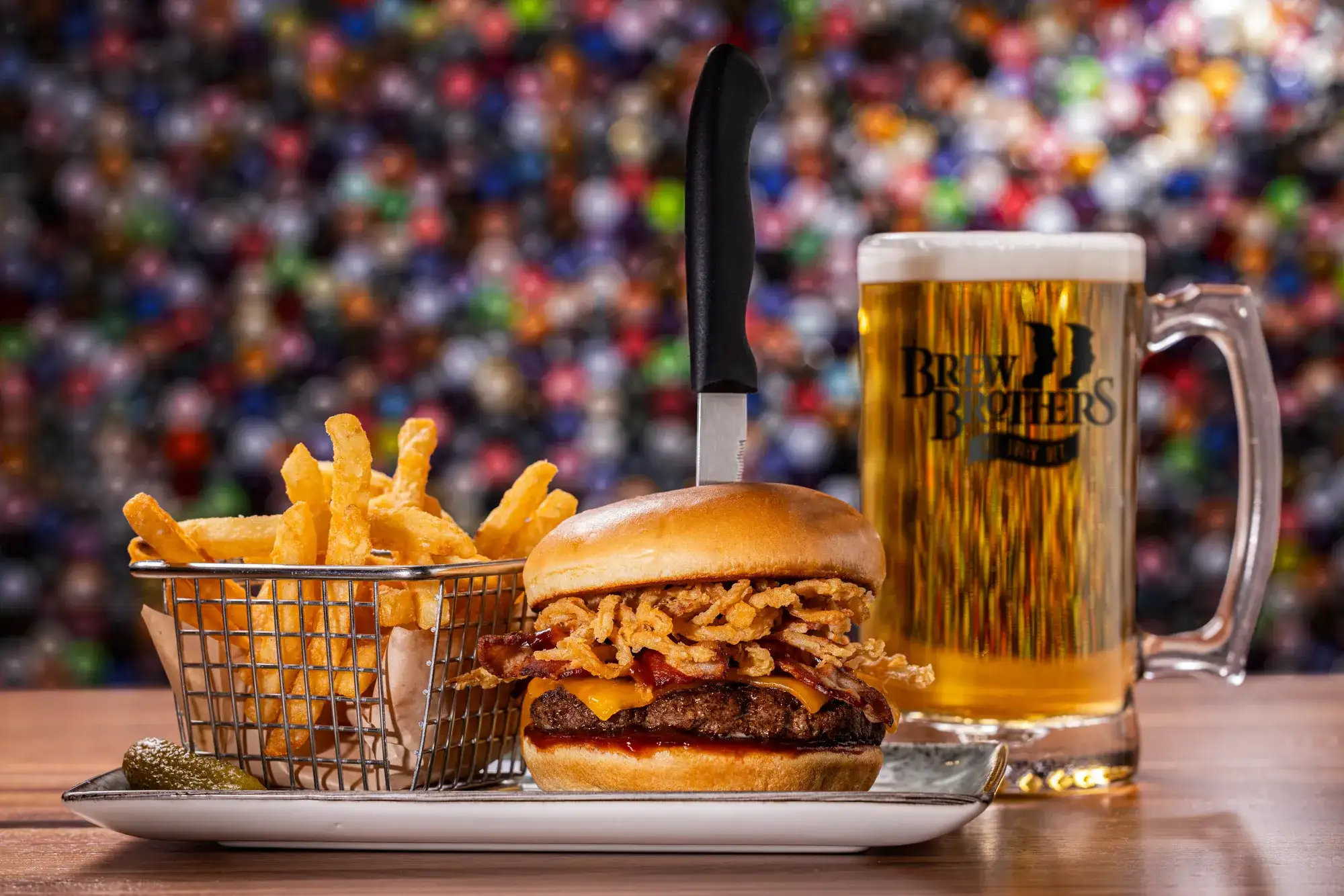 Burgers, fries, and drink served on a table