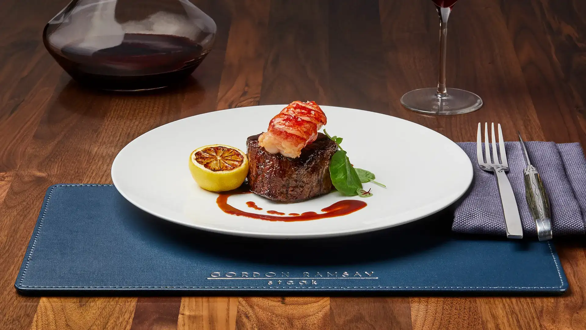 Filet mignon, lobster tail, and garnish.
