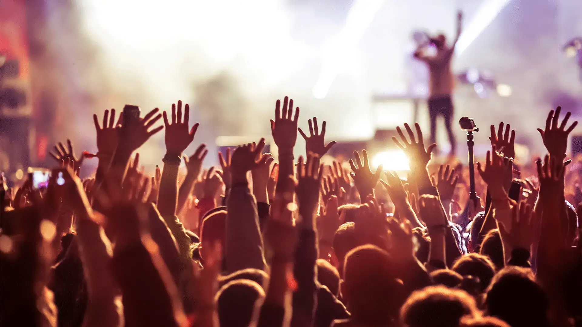 Crowd at a Concert with Birght White and Yellow Lights