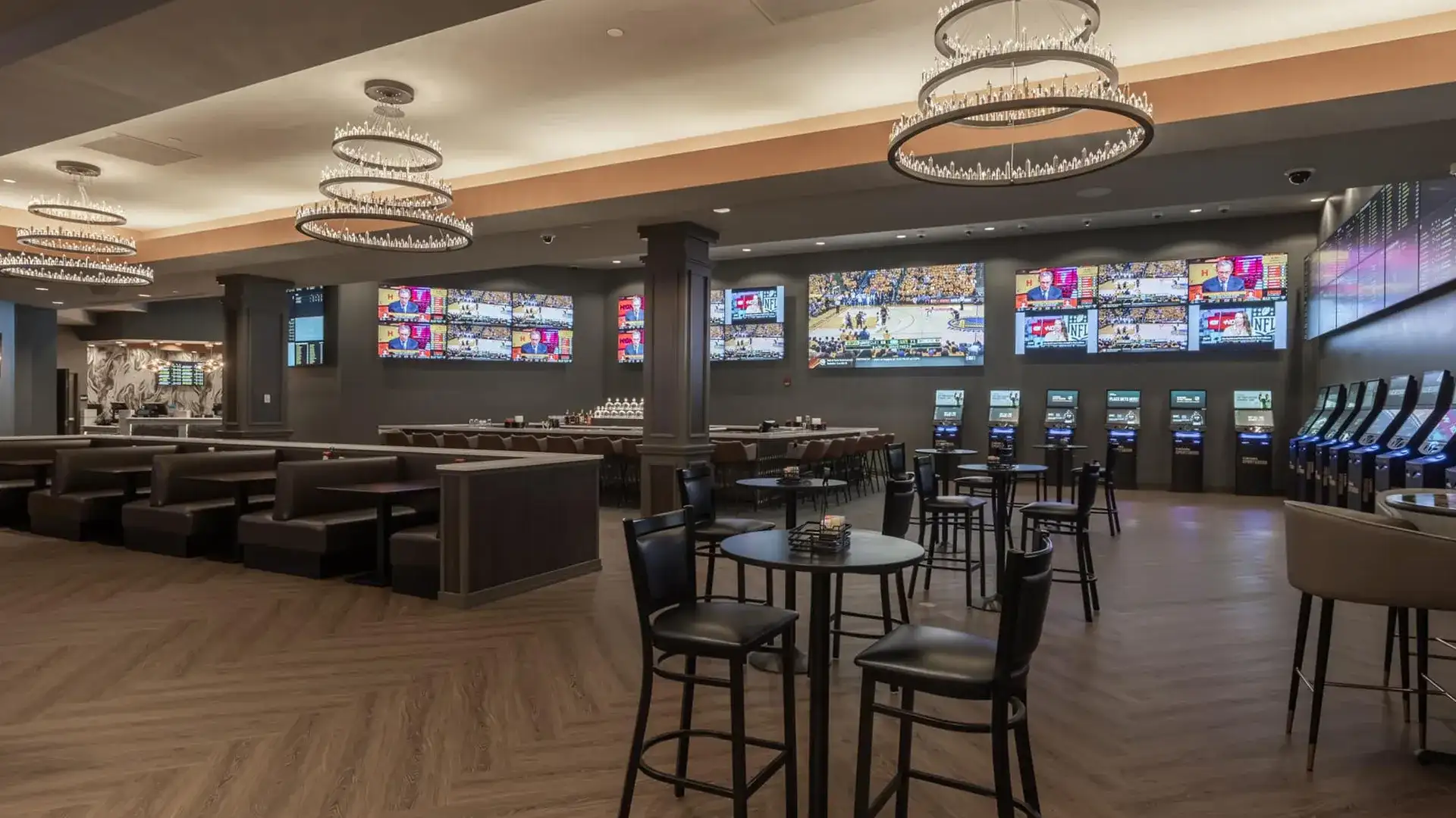 Caesars Sportsbook seating area and TV displays at Horseshoe Bossier City.