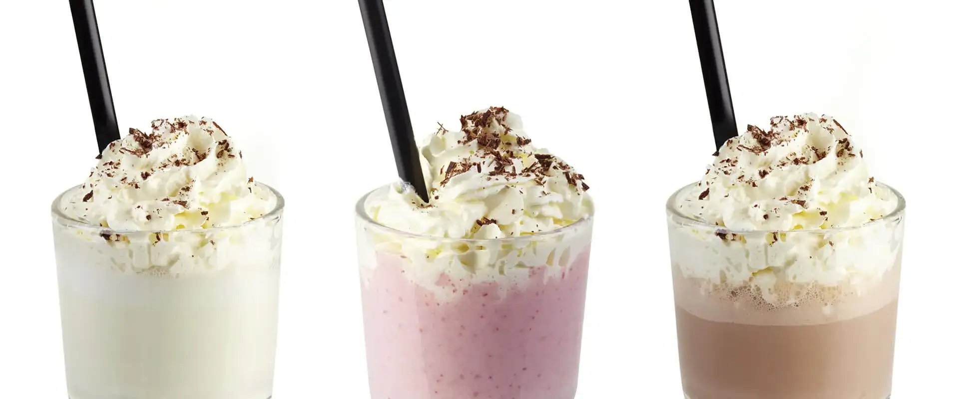 Three milk shakes with whip cream.