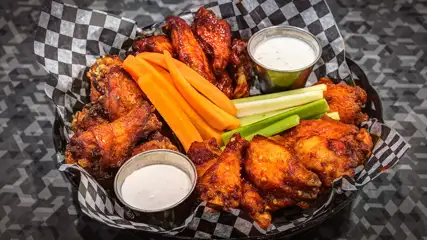 Chicken wings, cruditè, and dip.