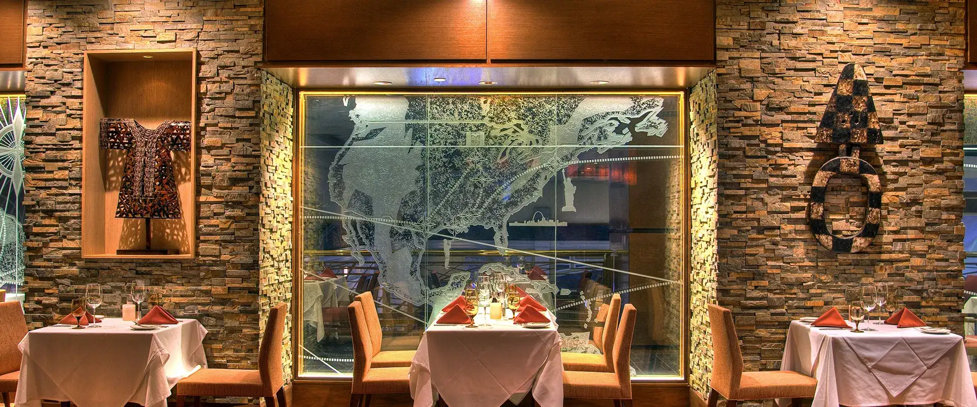 Three tables, a large window, and art displays at Farraddays.