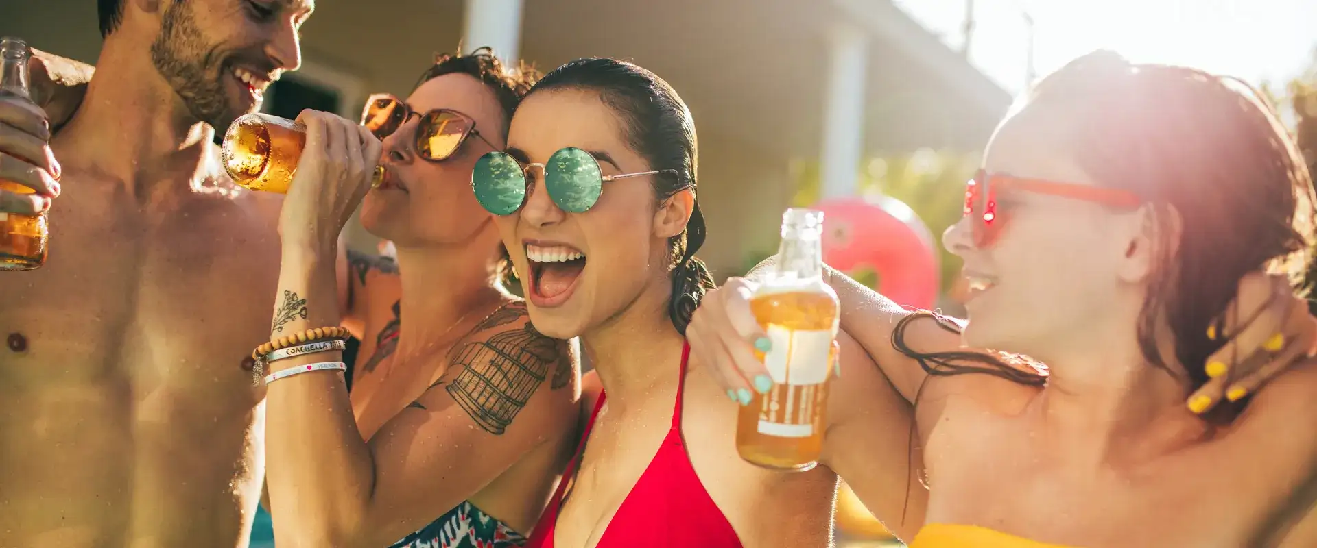 Friends having drinks at the pool.