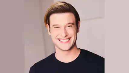Entertainer Tyler Henry smiling