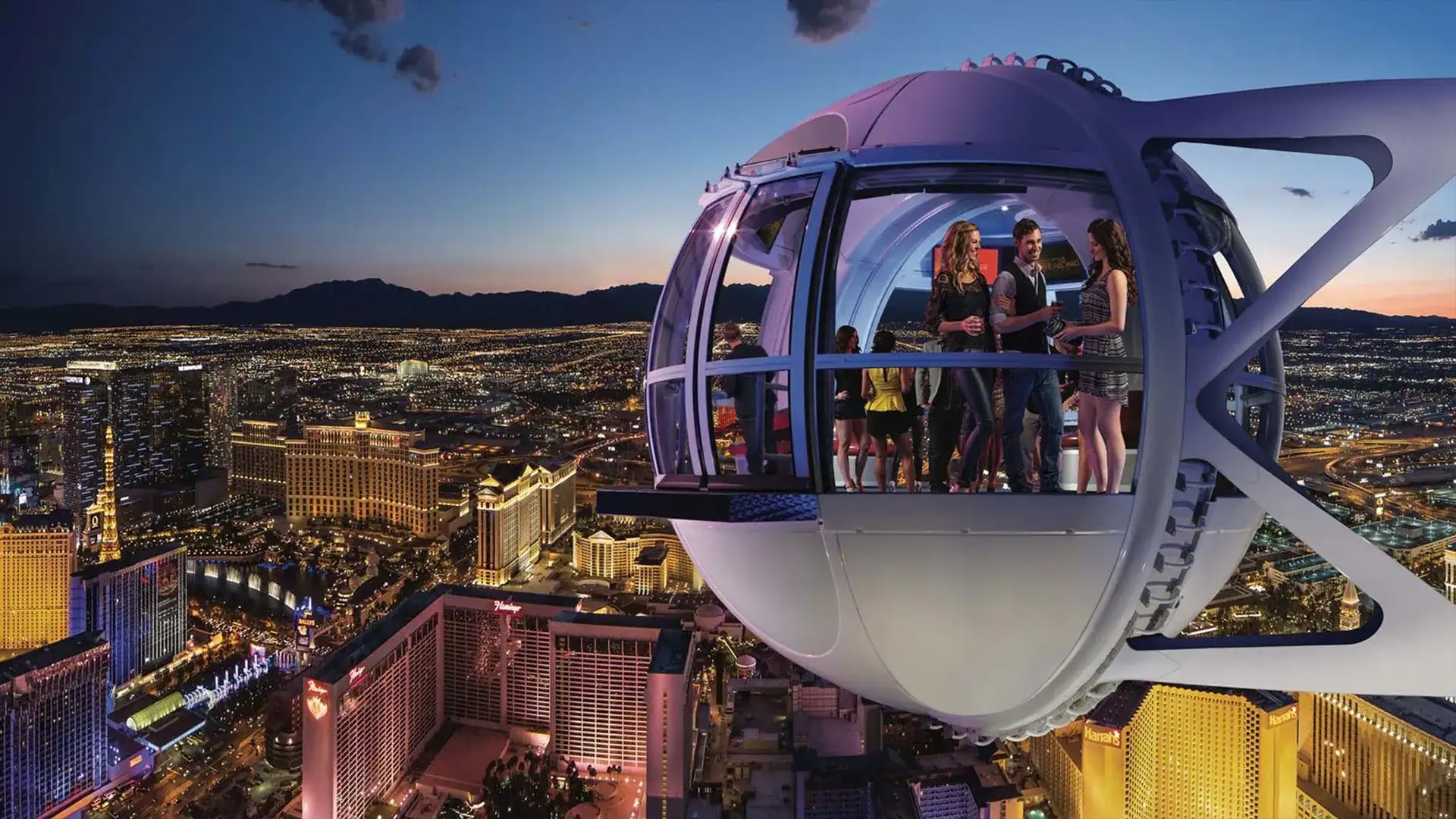 Guests enjoying panoramic views of the Las Vegas Strip at sunset from inside a High Roller Observation Wheel gondola pod at The LINQ